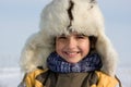 Smilling little boy in the fur-cap Royalty Free Stock Photo