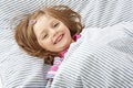 Smilling little girl in the bed Royalty Free Stock Photo