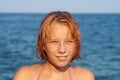 Smilling teenage girl on the background of the sea horizon portrait