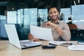 Smilling young African-American male designer, architect sitting in the office with documents Royalty Free Stock Photo