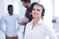 Smilling young business woman in front of her team. Royalty Free Stock Photo