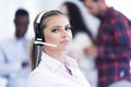 Smilling young business woman in front of her team. Royalty Free Stock Photo