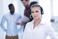 Smilling young business woman in front of her team. Royalty Free Stock Photo