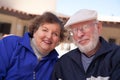 Smilng Senior Adult Couple Bundled Up Outdoors