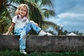 Smily caucasian kid girl with headphones looking in camera.