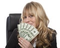 Smirking businesswoman with a fistful of dollars Royalty Free Stock Photo