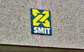 Smit International logo closeup on their office exterior in Houston, TX.