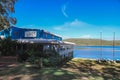 Smith`s Lake, NSW Australia - 29 April 2022: A sunny day at the Frothy Coffee Boatshed Cafe