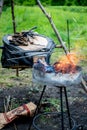 smith warms iron. Smith blows the coals and warm metal. Bellows. Royalty Free Stock Photo