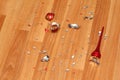 Smithereens of crushed red Christmas ball on floor. Royalty Free Stock Photo
