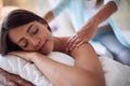 Smliling woman  lying on bed and enjoying at massage Royalty Free Stock Photo