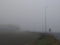Road, highway in fog gray heavy fog,