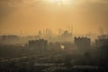 smoggy city skyline, with factory smoke and exhaust fumes in the distance