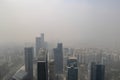 smoggy day, with view of bustling cityscape and towering skyscrapers