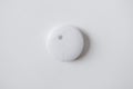 Smoke alarm, sensor or detector on white ceiling Royalty Free Stock Photo