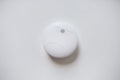 Smoke alarm, sensor or detector on white ceiling Royalty Free Stock Photo