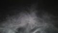 Smoke background. Abstract smoke cloud. Smoke in slow motion on black background. White smoke slowly floating through