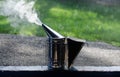 Smoke for the beekeeper. Apiary. Smoke. Beekeeper. Royalty Free Stock Photo