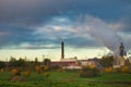 Smoke billowing from industrial smokestacks at factory or plant Royalty Free Stock Photo