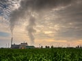 Smoke from the boiler stack and the vapor from a cooling tower in the power plant Royalty Free Stock Photo