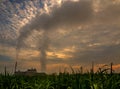 Smoke from the boiler stack and the vapor from a cooling tower in the power plant Royalty Free Stock Photo