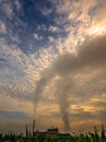 Smoke from the boiler stack and the vapor from a cooling tower in the power plant Royalty Free Stock Photo