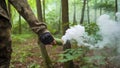 Smoke Bomb in Hand. Prisoner in camouflage with a smoke bomb Royalty Free Stock Photo