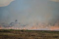 Smoke from burning. Farmers burn rice straw to prepare to plant rice for the next season. Toxic effect resulting from burning of Royalty Free Stock Photo