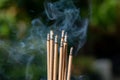 Smoke of burning incense sticks in temple, selective focus Royalty Free Stock Photo