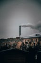 Smoke from the chimney at the factory, heat network, workshop, enterprise. Smoke in the city. Ecology city infection. Harmful