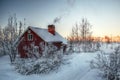 Smoke from the chimney of a Swedish house in winter Royalty Free Stock Photo