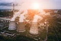 Smoke from chimneys of thermal power plant or station in sunlight, aerial view from drone Royalty Free Stock Photo