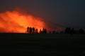 Smoke column from wildfire ant night