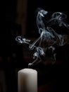 Smoke coming from a blown out candle Royalty Free Stock Photo