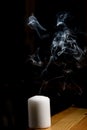 Smoke coming from a blown out candle Royalty Free Stock Photo