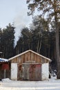 smoke coming from the chimney of a village house Royalty Free Stock Photo