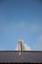 Smoke coming out the chimney against sky Royalty Free Stock Photo