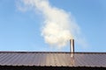 Smoke coming out the chimney against sky Royalty Free Stock Photo