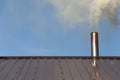 Smoke coming out the chimney against sky Royalty Free Stock Photo