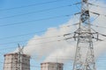 Smoke cooling tower pollution of the surrounding air environment of the atmosphere from the industrial plant and power lines high Royalty Free Stock Photo