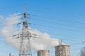 Smoke cooling tower pollution of the surrounding air environment of the atmosphere from the industrial plant and power lines high Royalty Free Stock Photo