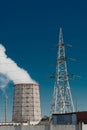 Smoke cooling tower pollution of the surrounding air environment of the atmosphere from the industrial plant and power lines high Royalty Free Stock Photo