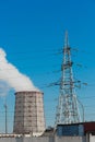 Smoke cooling tower pollution of the surrounding air environment of the atmosphere from the industrial plant and power lines high Royalty Free Stock Photo