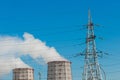 Smoke cooling tower pollution of the surrounding air environment of the atmosphere from the industrial plant and power lines high Royalty Free Stock Photo