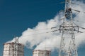 Smoke cooling tower pollution of the surrounding air environment of the atmosphere from the industrial plant and power lines high Royalty Free Stock Photo