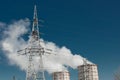 Smoke cooling tower pollution of the surrounding air environment of the atmosphere from the industrial plant and power lines high Royalty Free Stock Photo