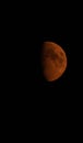 Smoke covered red half moon on black sky Royalty Free Stock Photo