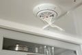 Smoke detector with alarm in kitchen ceiling for safety and fire prevention Royalty Free Stock Photo