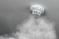 Smoke detector, fire alarm in action Royalty Free Stock Photo