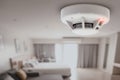 Smoke detector fire alarm detector home safety device setup at home hotel room ceiling Royalty Free Stock Photo